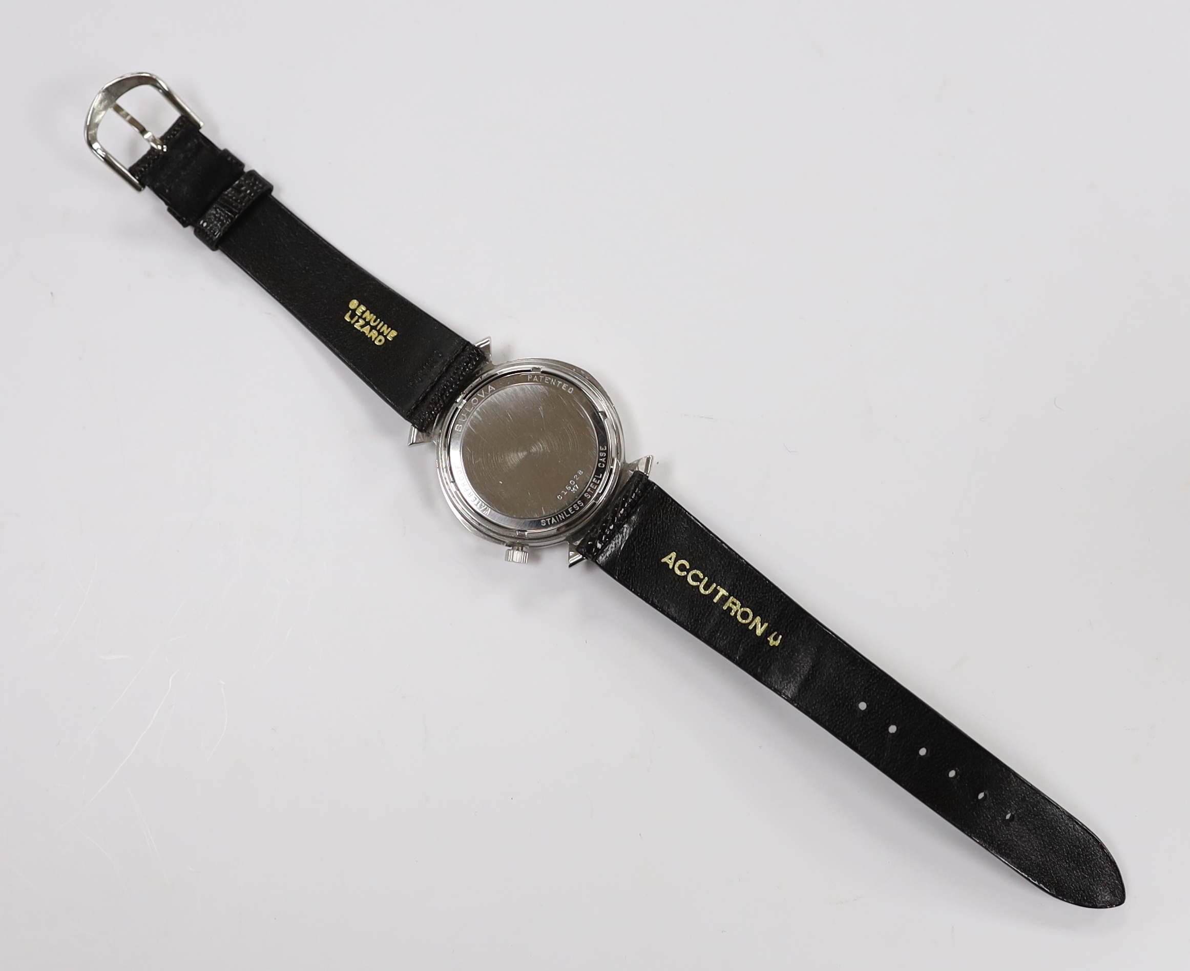 A gentleman's stainless steel Bulova Accutron wrist watch, with pale yellow dial, on Accutron strap, case diameter 36mm.